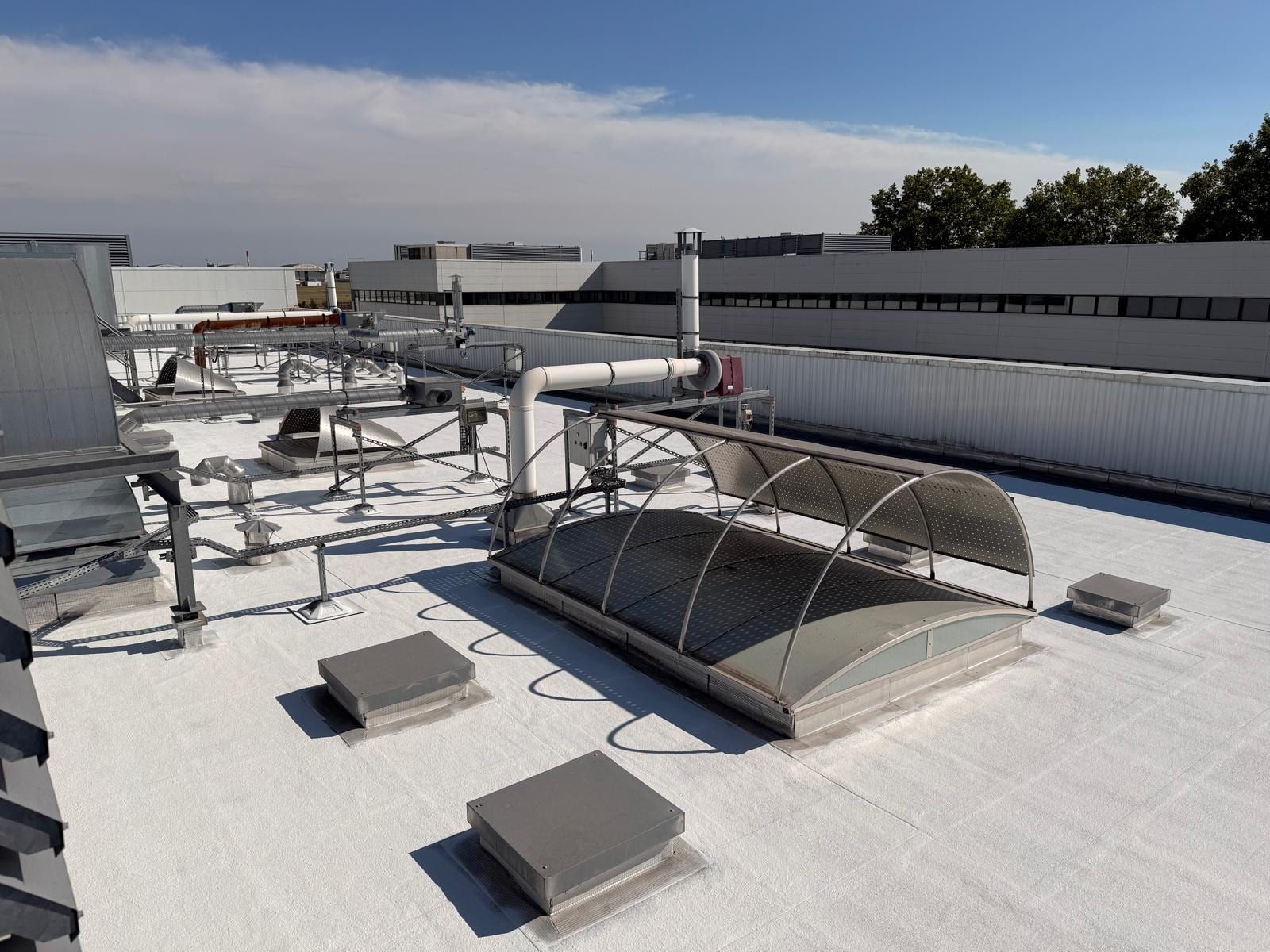 White treated roof, rooflight and rooftop pipework preserved