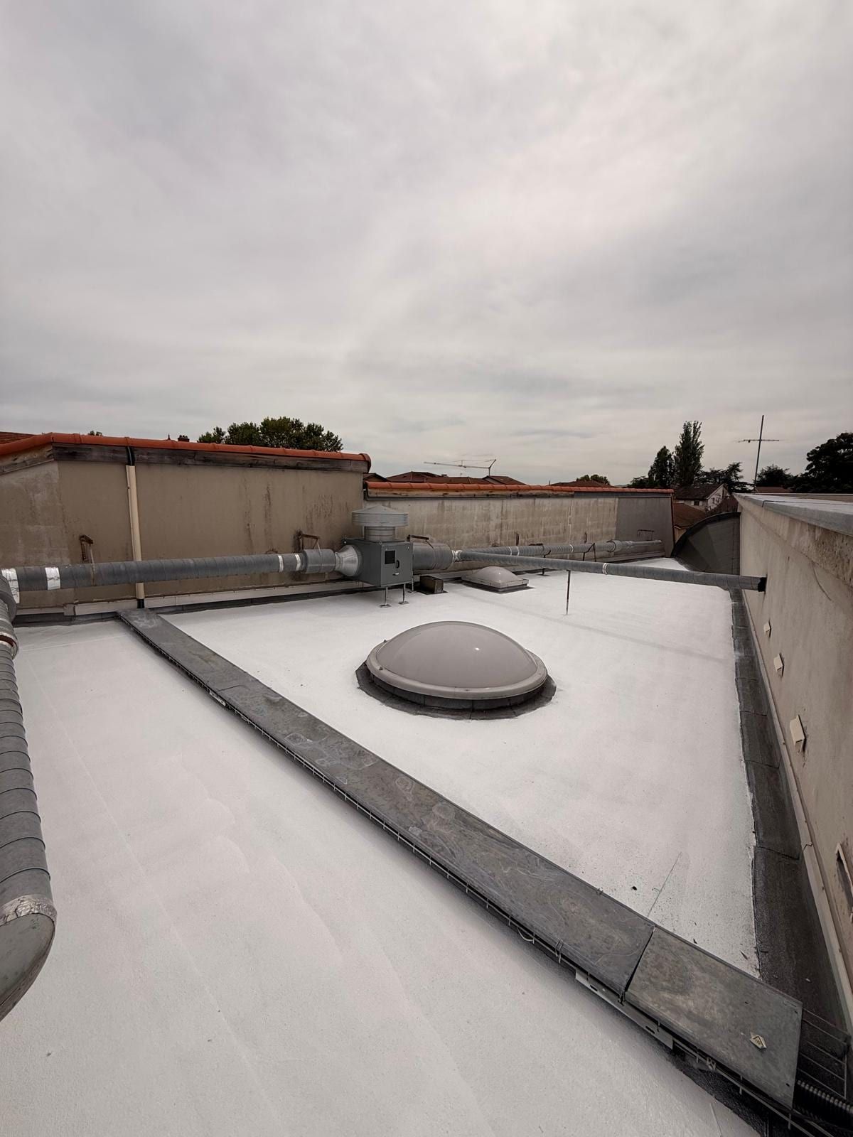 Treated roof with smoke-vent dome and pipework preserved