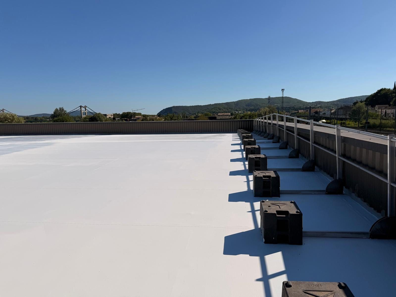 PVC membrane roof of the Eurotyre centre in Le Teil treated with a cool roof