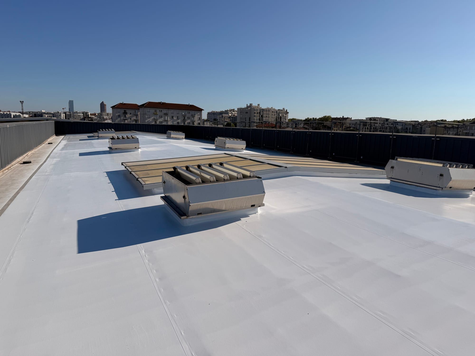 Treated roof with rooflights and ventilation units preserved