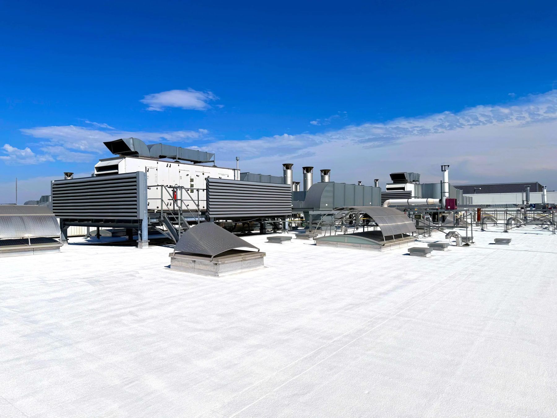 White roof of a commercial building with air-handling units